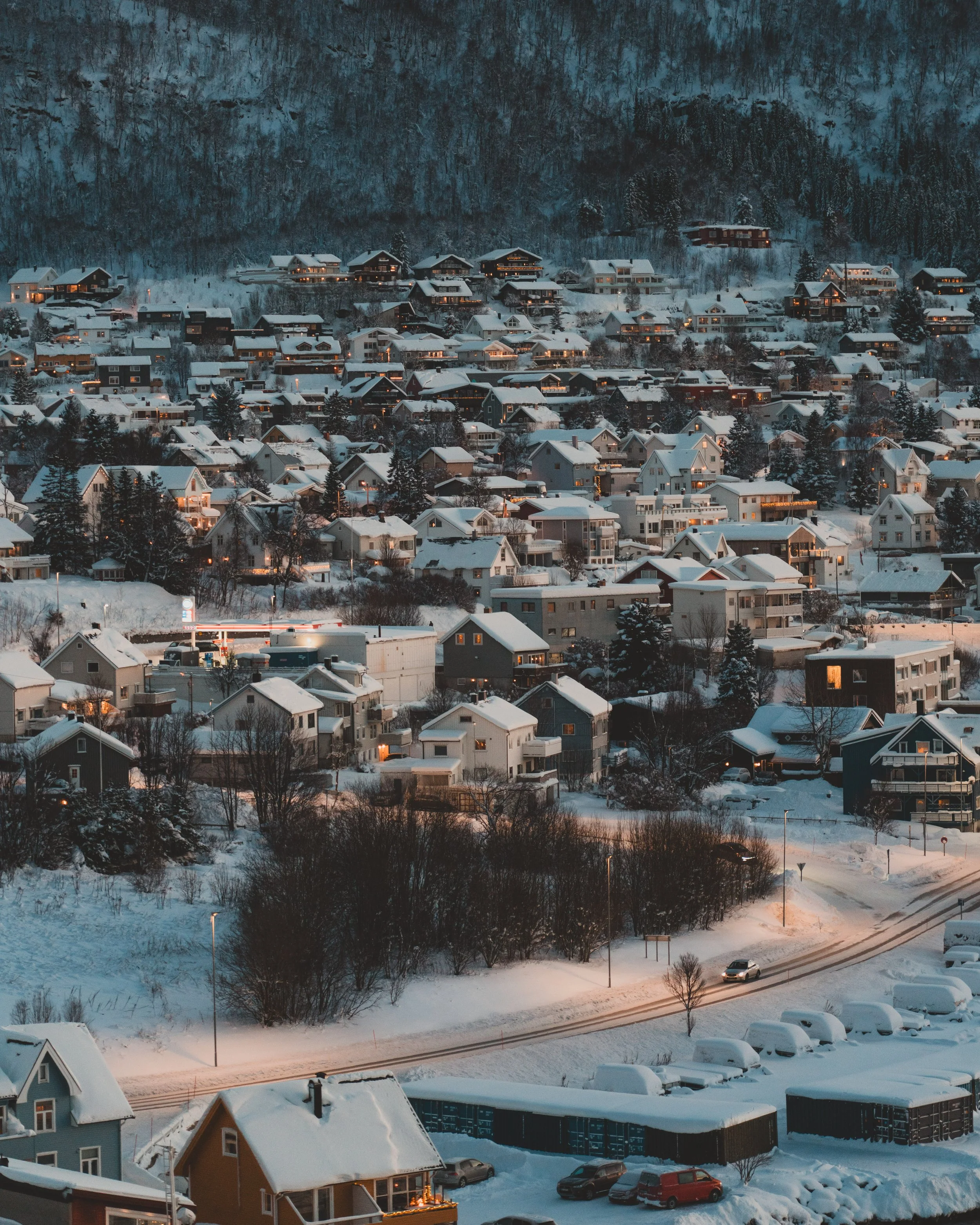 Tromso houses under the snow at twilight