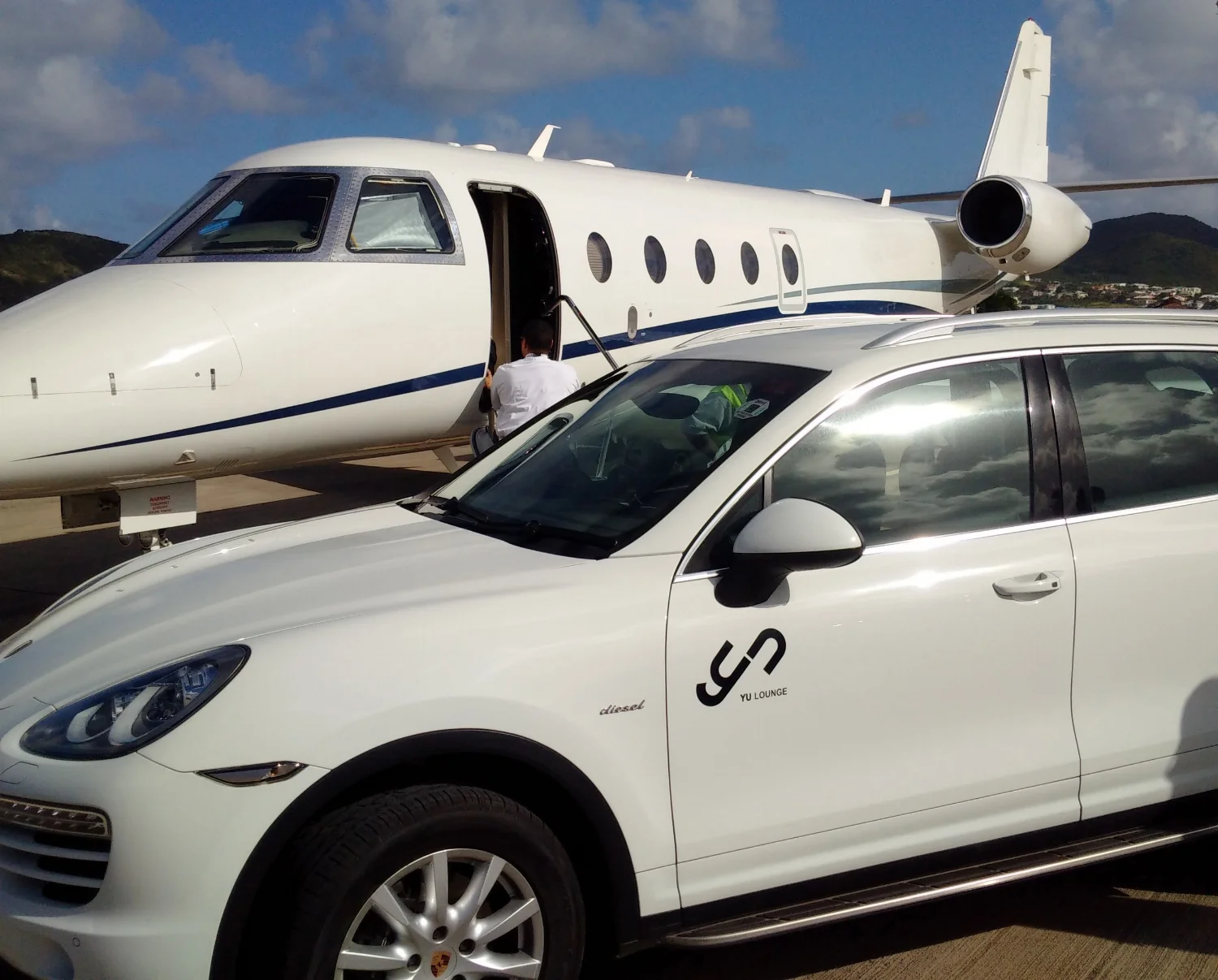 FBOs provide a top-notch welcome experience for private fliers, such as this chauffeured Porsche Cayenne at the Yu Lounge, St. Kitts/ St. Kitts and Nevis.