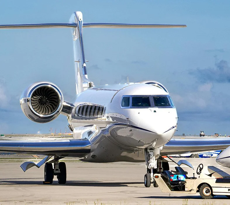 Private jet on the tarmac with ground support