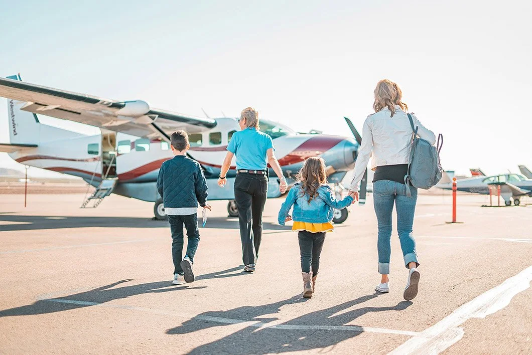 Family boarding a private jet