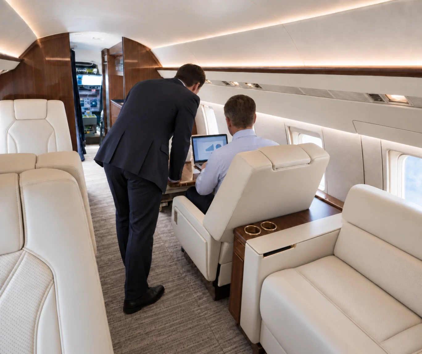 Business travelers working on a business jet