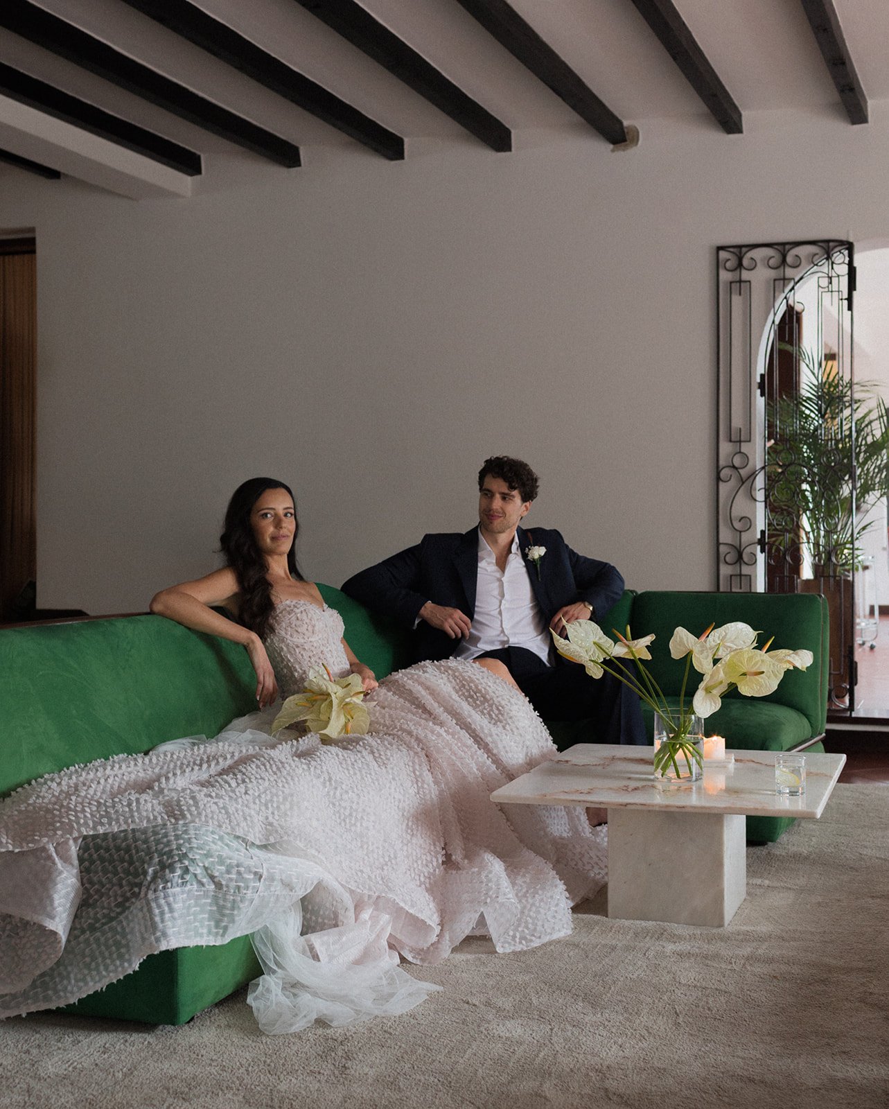 Couple seated in conversation at Marqi, Sintra Portugal | destination wedding photography by The Lopes Photography