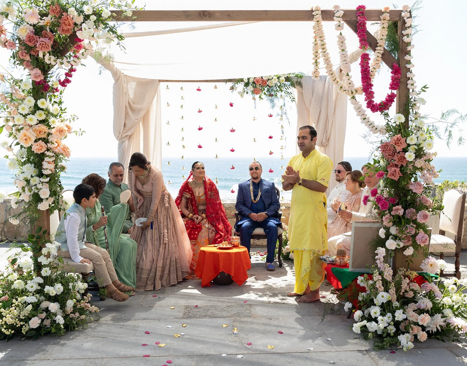 Indian wedding ceremony under floral mandap at Fortaleza do Guincho, Cascais, by The Lopes Photography