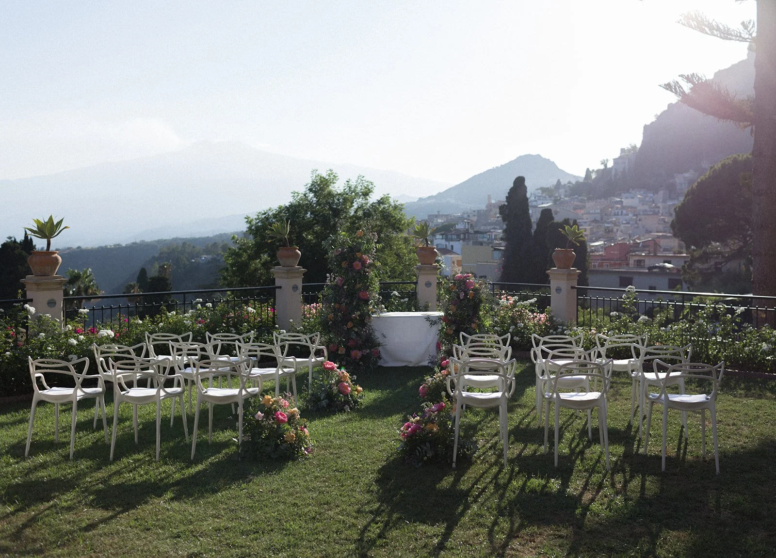 Terrace ceremony setup above a hillside town, Belmond Grand Hotel Timeo, wedding photography by The Lopes Photography