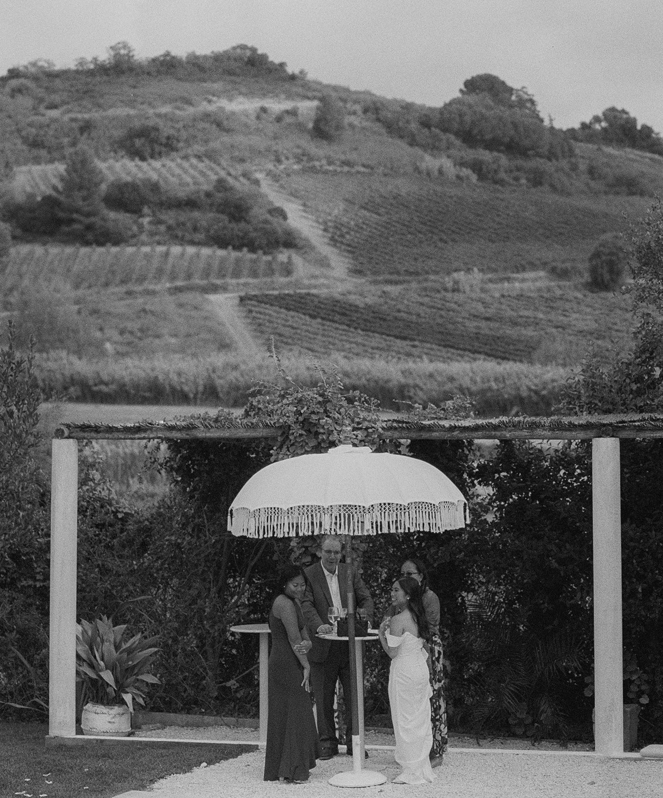 Black and white photos of guests at cocktail hour.jpg