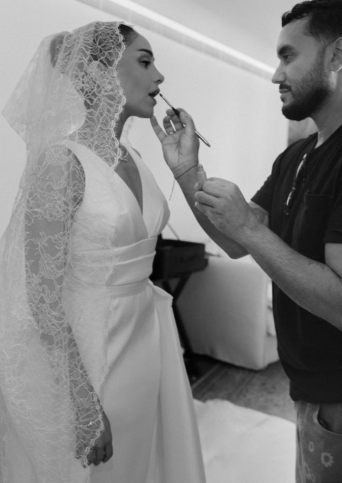 Makeup artist applying lipstick, Palácio de Queluz, wedding photography by The Lopes Photography, published in Vogue Arabia