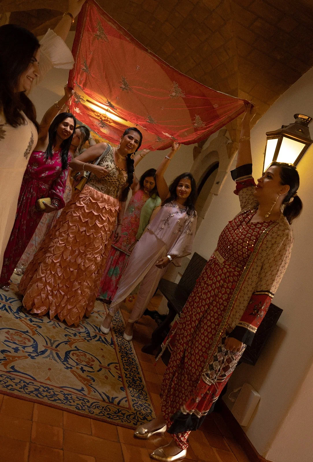 Asian bridal party in vibrant traditional attire at Fortaleza do Guincho, by The Lopes Photography