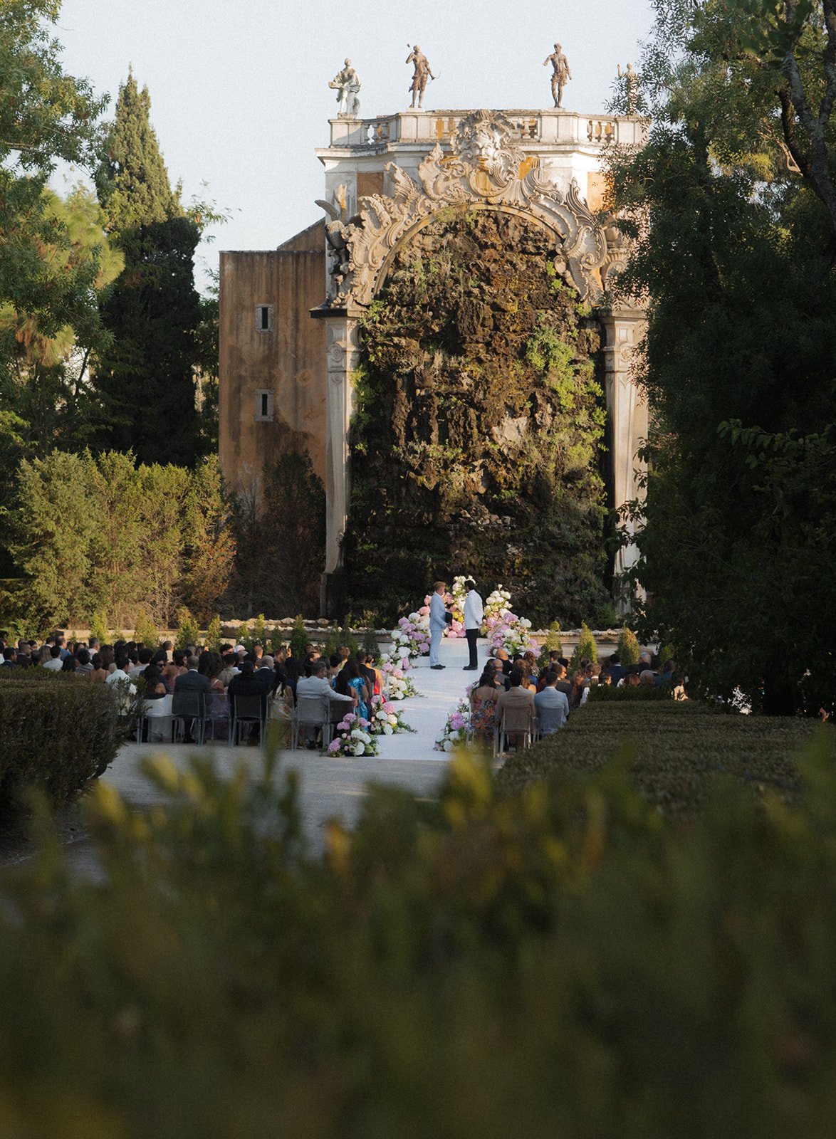 Wedding ceremony in the formal gardens of Palácio de Queluz, Portugal, photographed by The Lopes Photography