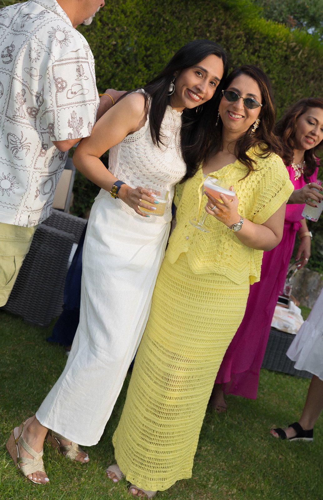 Guests on estate lawn at golden hour, Fortaleza do Guincho, destination wedding photography by The Lopes Photography