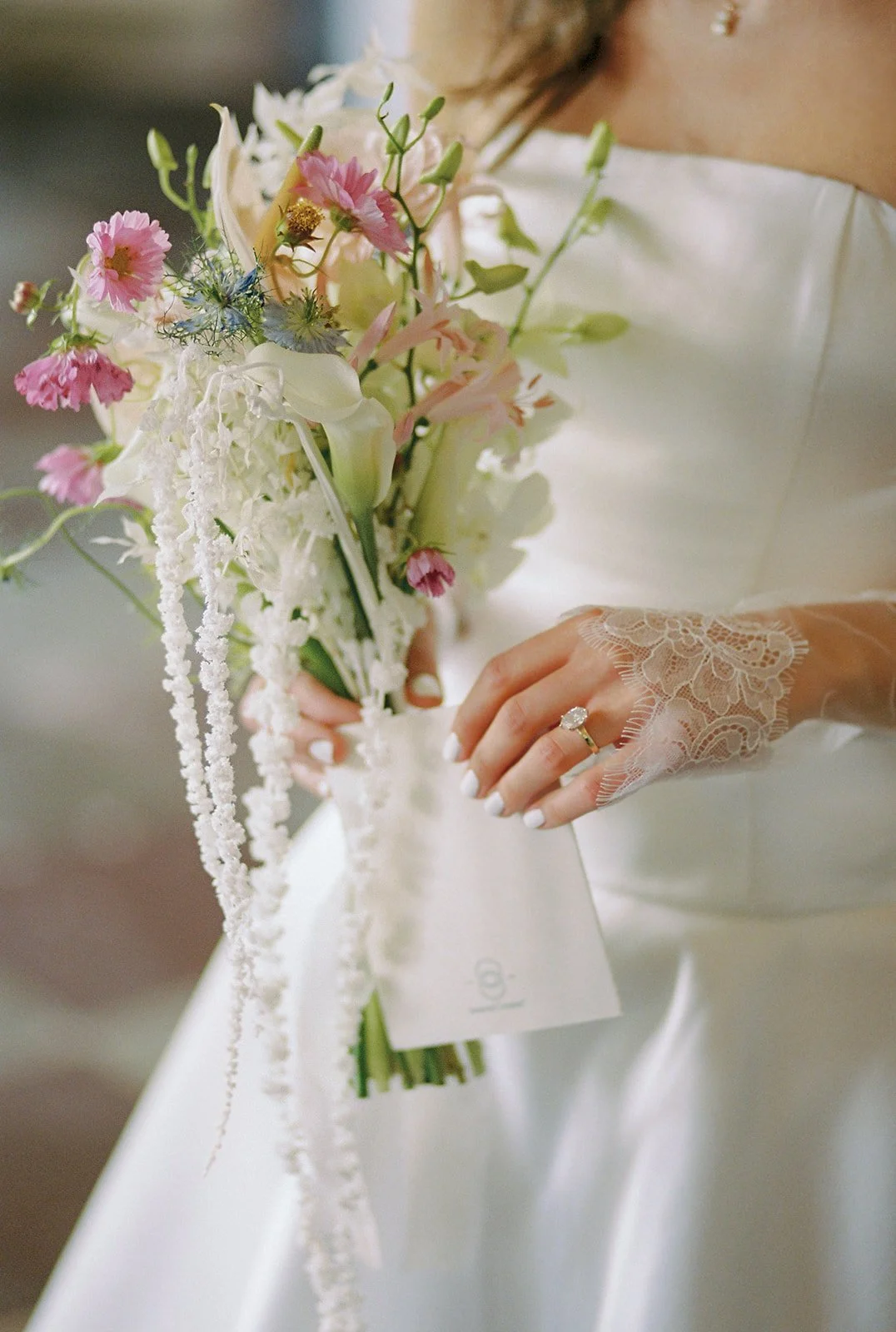 Close-up of the bride's bouquet, lace gloves and engagement ring at Palácio de Tancos, Lisbon wedding | The Lopes Photography