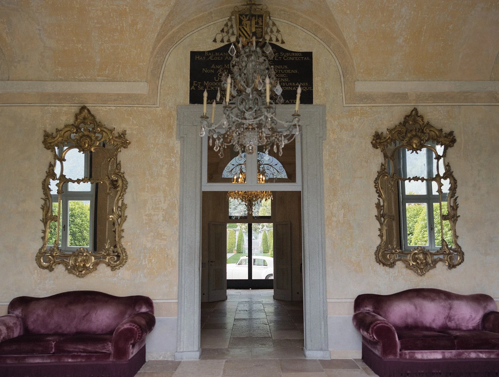 Neoclassical interior hall at Villa Balbiano with marble walls and crystal chandelier, Lake Como, Italy, destination wedding photography — The Lopes Photography