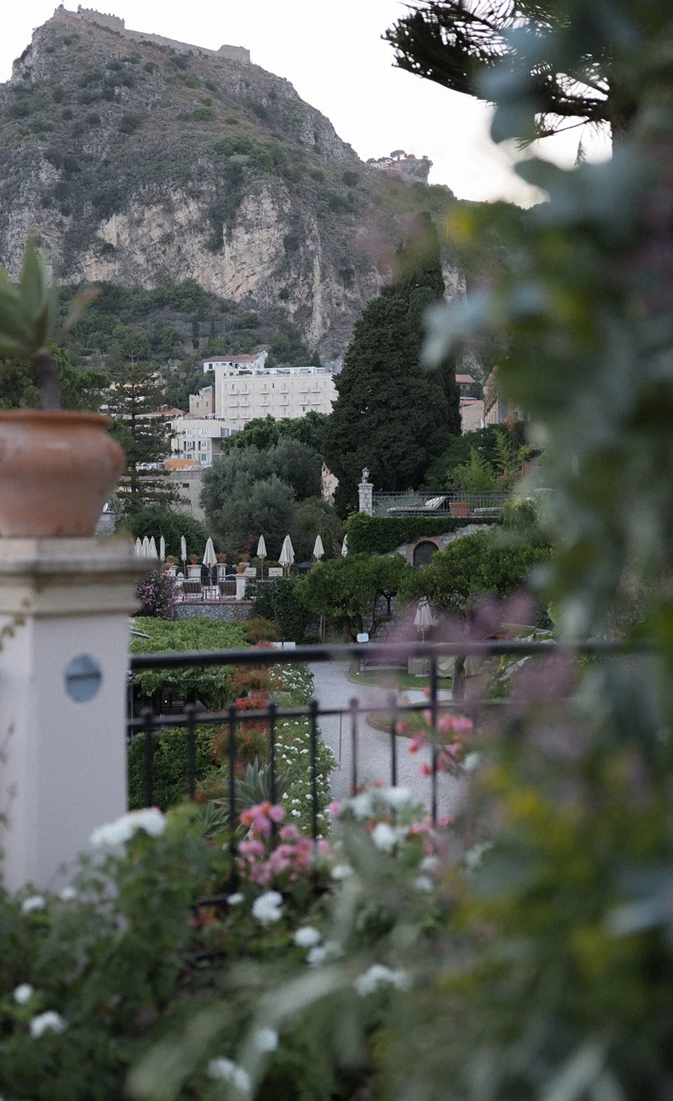 Sicilian coastal town framed by flowers, Belmond Grand Hotel Timeo, wedding photography by The Lopes Photography