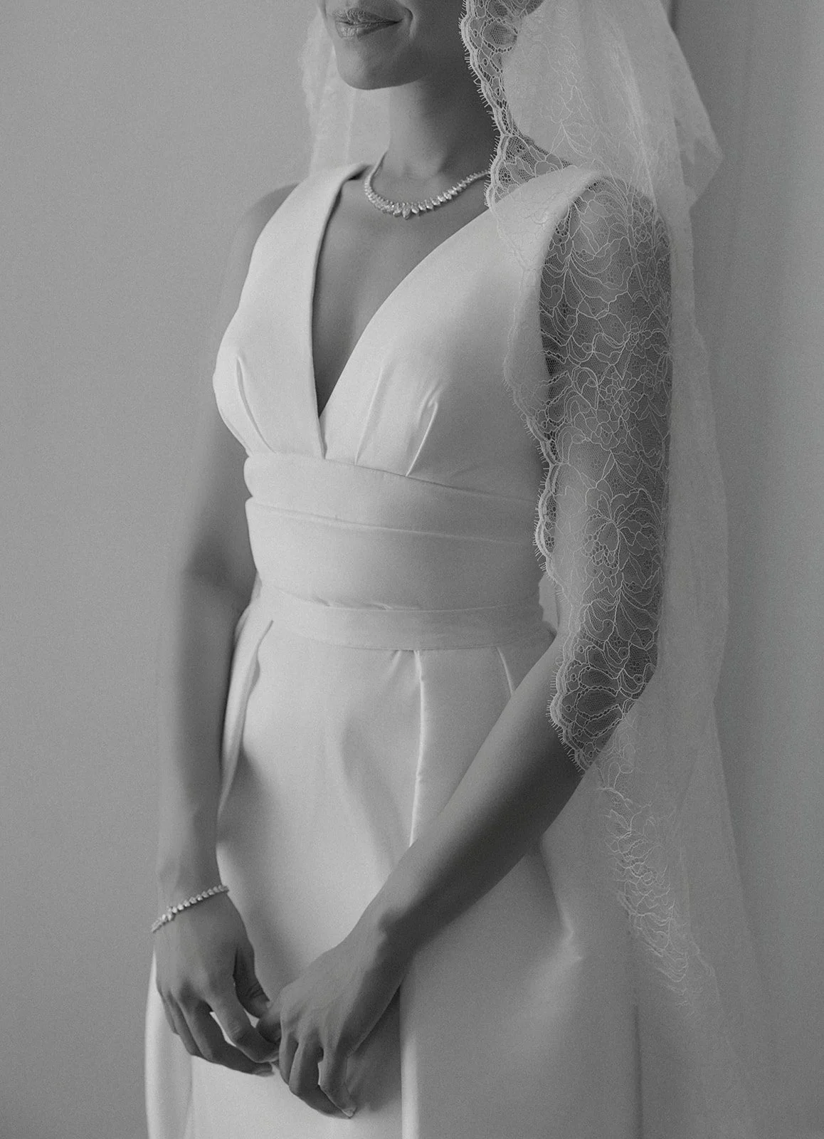 Bride with lace veil and diamond jewelry during Queluz wedding preparation, editorial photography by The Lopes Photography