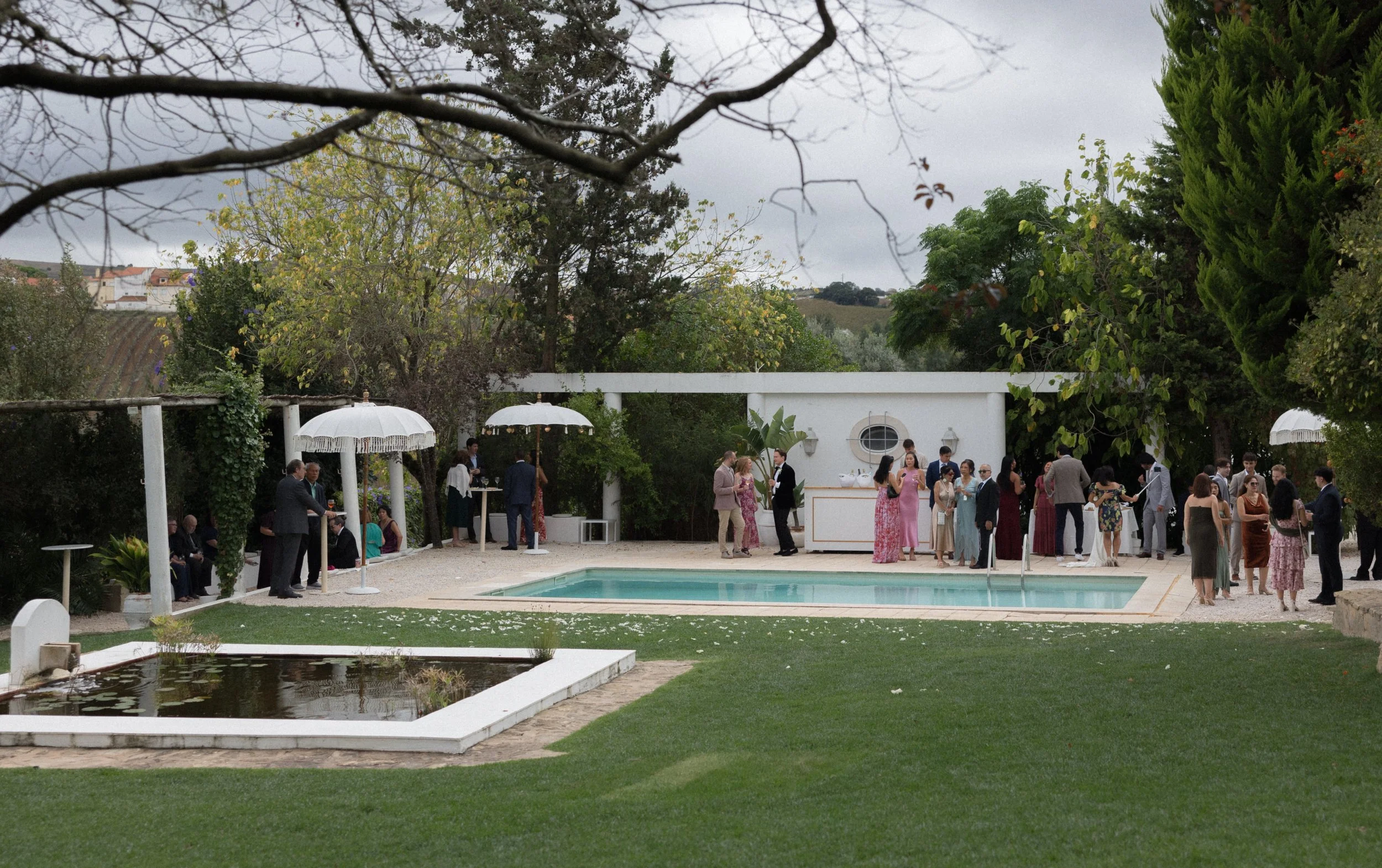 Mid-size destination wedding in Portugal with guests during cocktail hour and venue atmosphere
