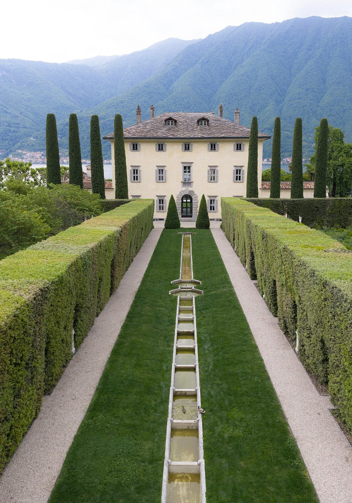 Aerial view of Villa Balbiano's formal gardens and pale villa above Lake Como, Italy, destination wedding photography — The Lopes Photography