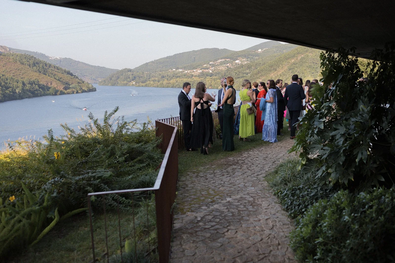 Guests on cobblestone terrace, Octant Douro, Douro Valley Portugal | destination wedding photography by The Lopes Photography