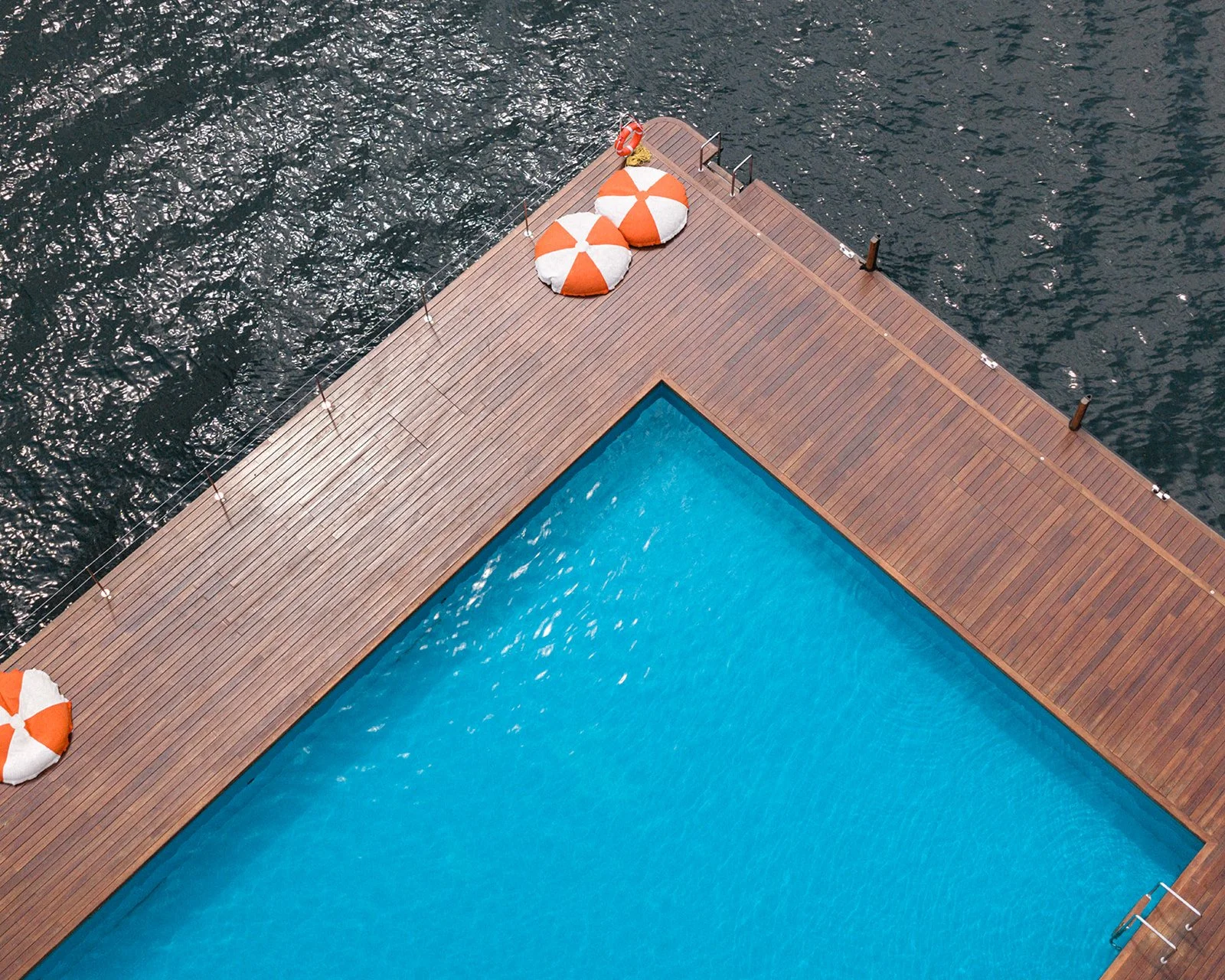 Aerial view of Grand Hotel Tremezzo's floating pool and beach deck, Lake Como, Italy, destination wedding photography — The Lopes Photography