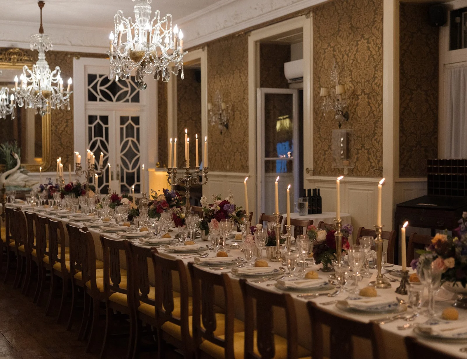 Elegant evening reception scene at a destination wedding in Portugal photographed with atmospheric light and refined storytelling