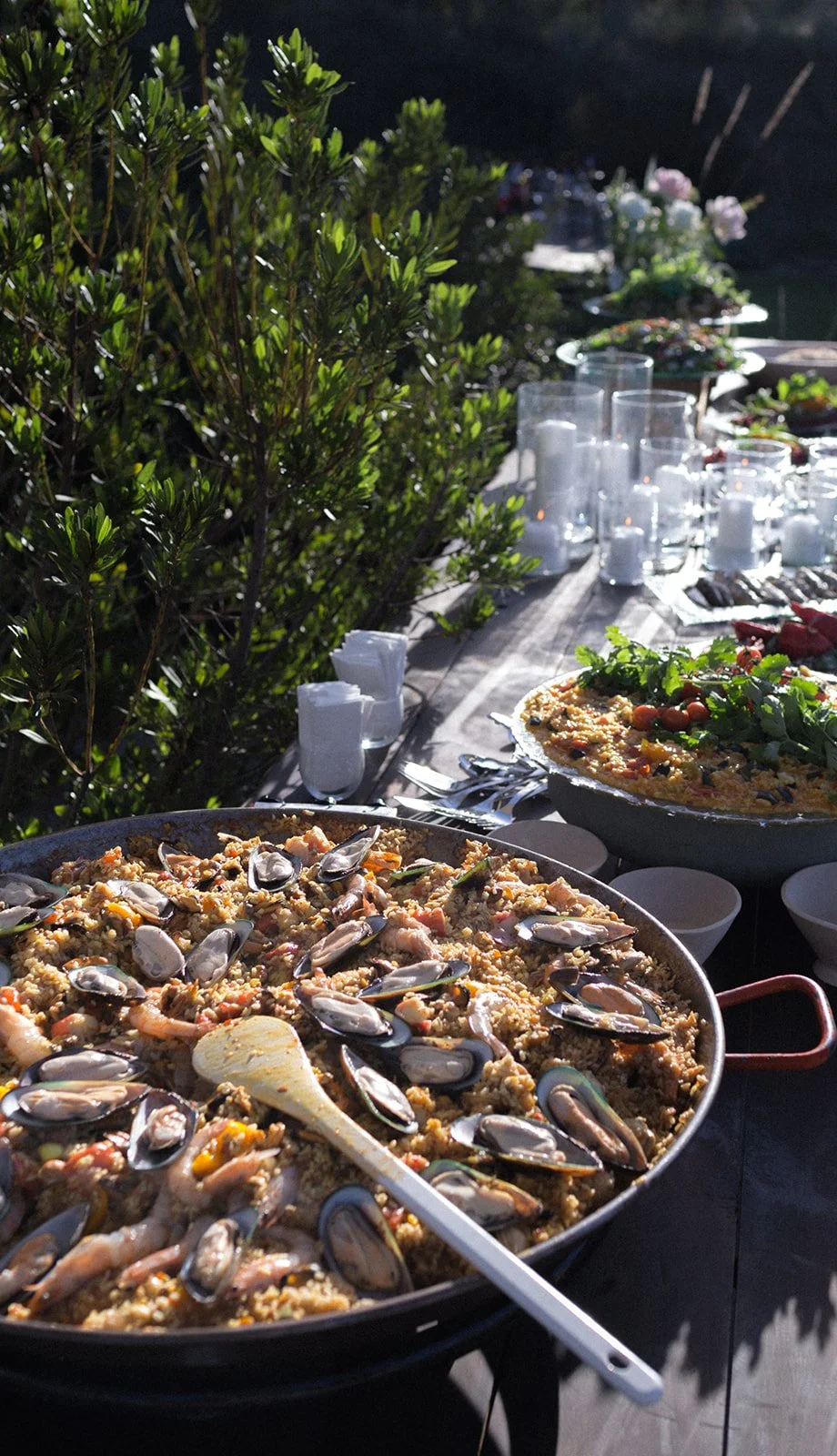 Outdoor dining with paella, Spatia Comporta, wedding photography by The Lopes Photography, published in Together Journal