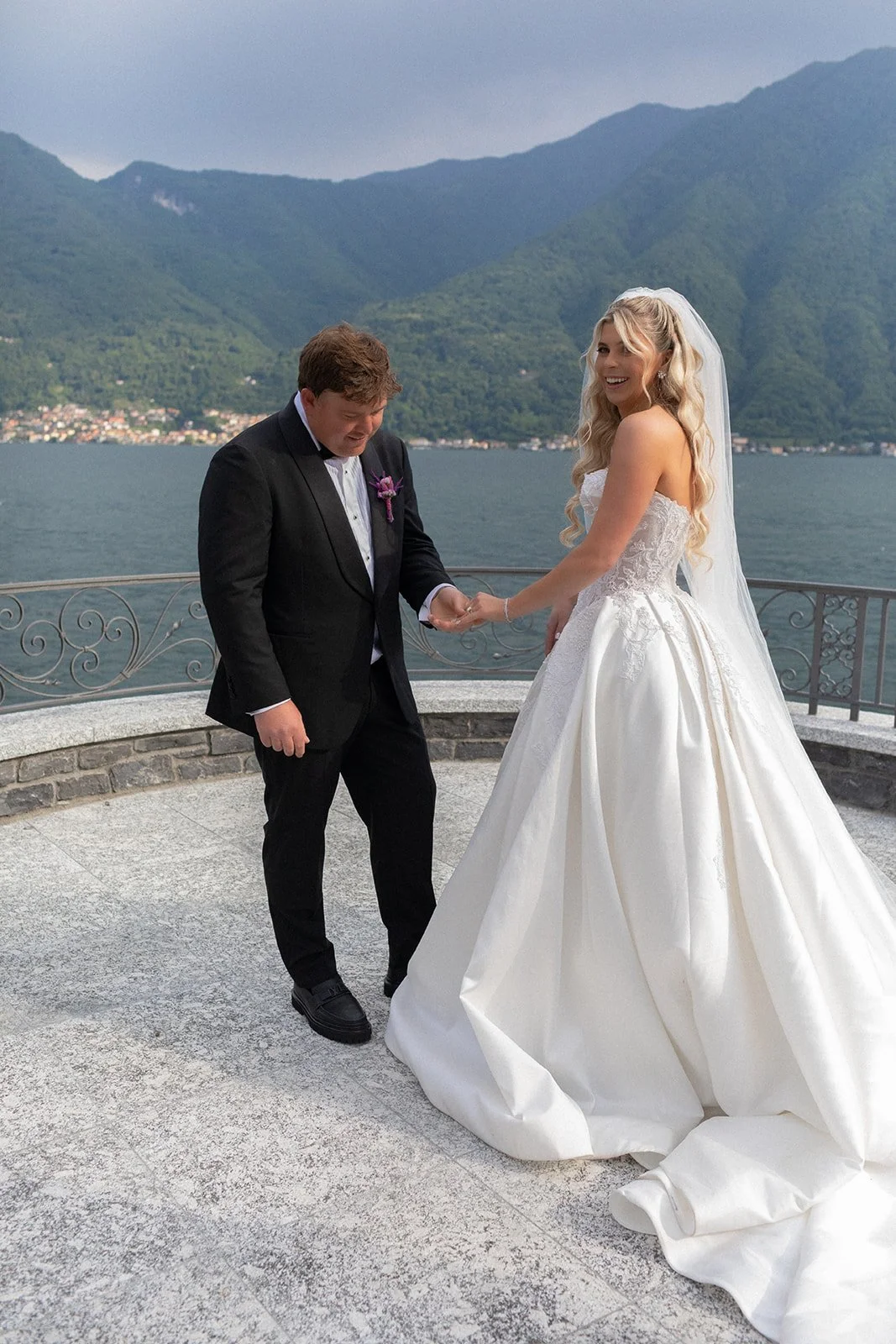 Couple holding hands on the terrace under soft overcast light, Villa Balbiano, wedding photography by The Lopes Photography