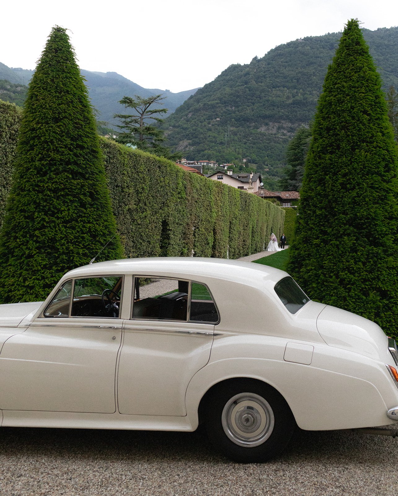 Villa Balbiano entrance facade with white Rolls-Royce parked outside, Lake Como, Italy, destination wedding photography — The Lopes Photography