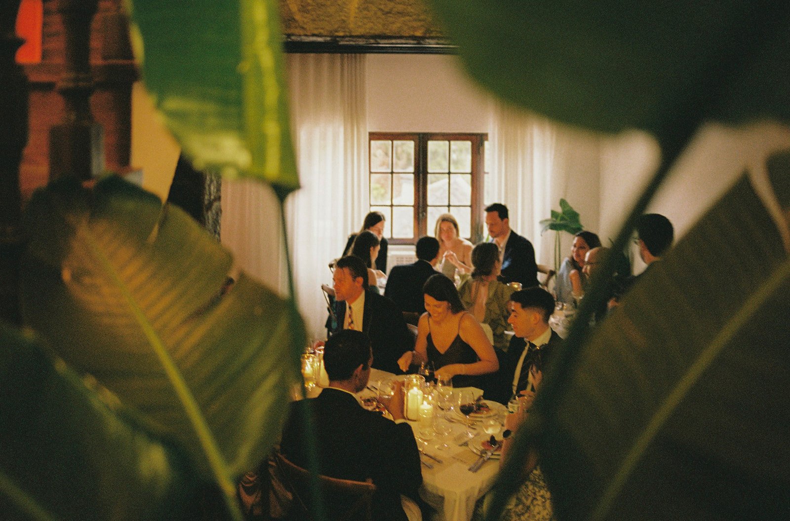 Film photo of guests enjoyinh a dinner at a destination wedding dinner at Marqí in Portugal