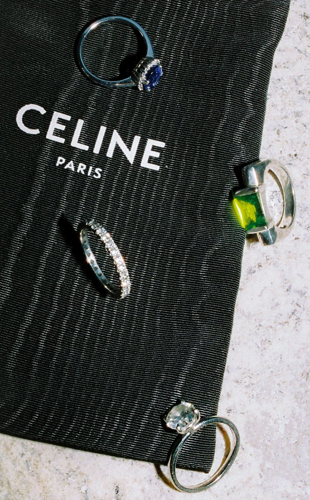 Film photo of a flatlay of several bride's rings during preparation at Torel Saboaria in Porto