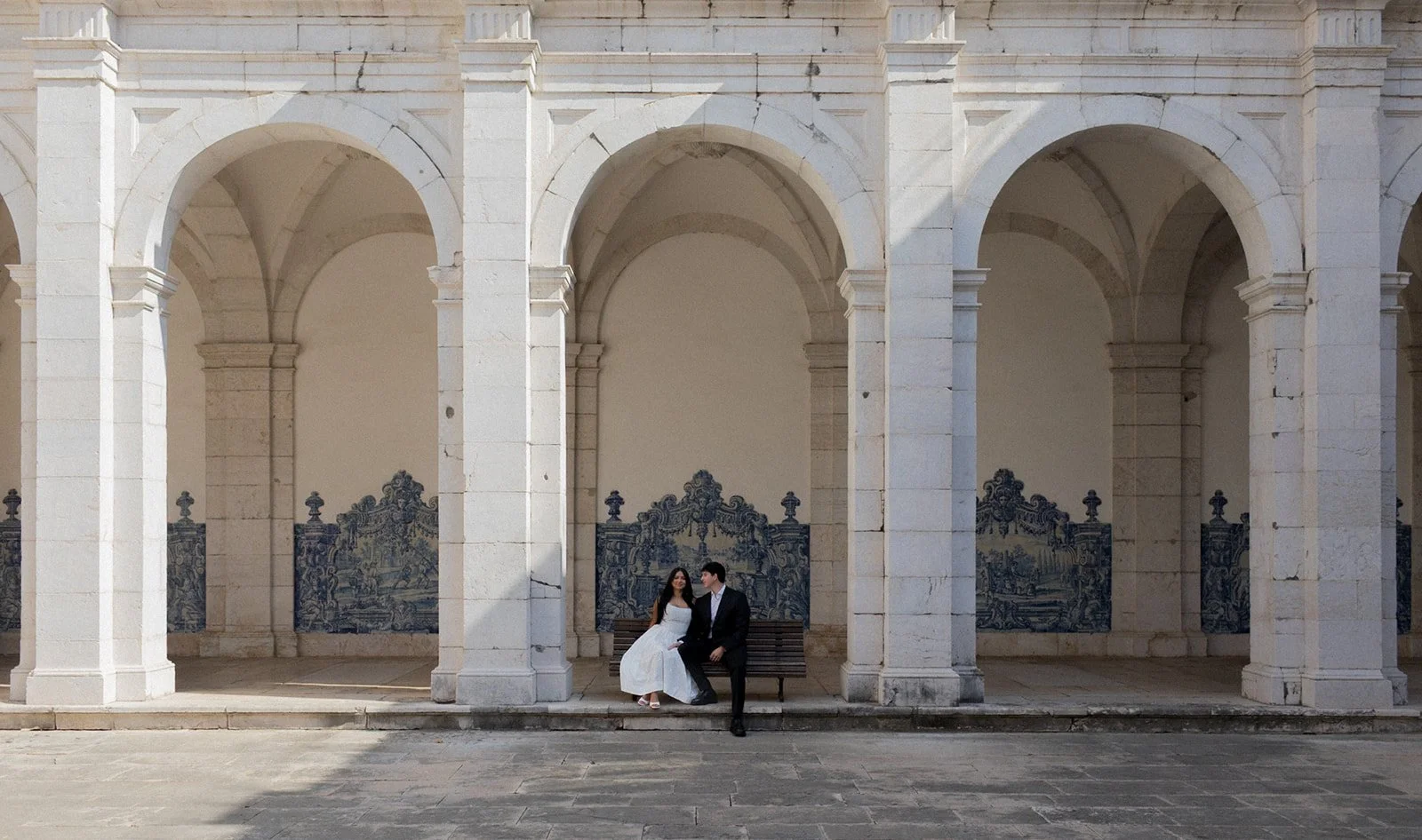 Editorial destination wedding photography in Portugal showing a couple framed within architecture and sense of place