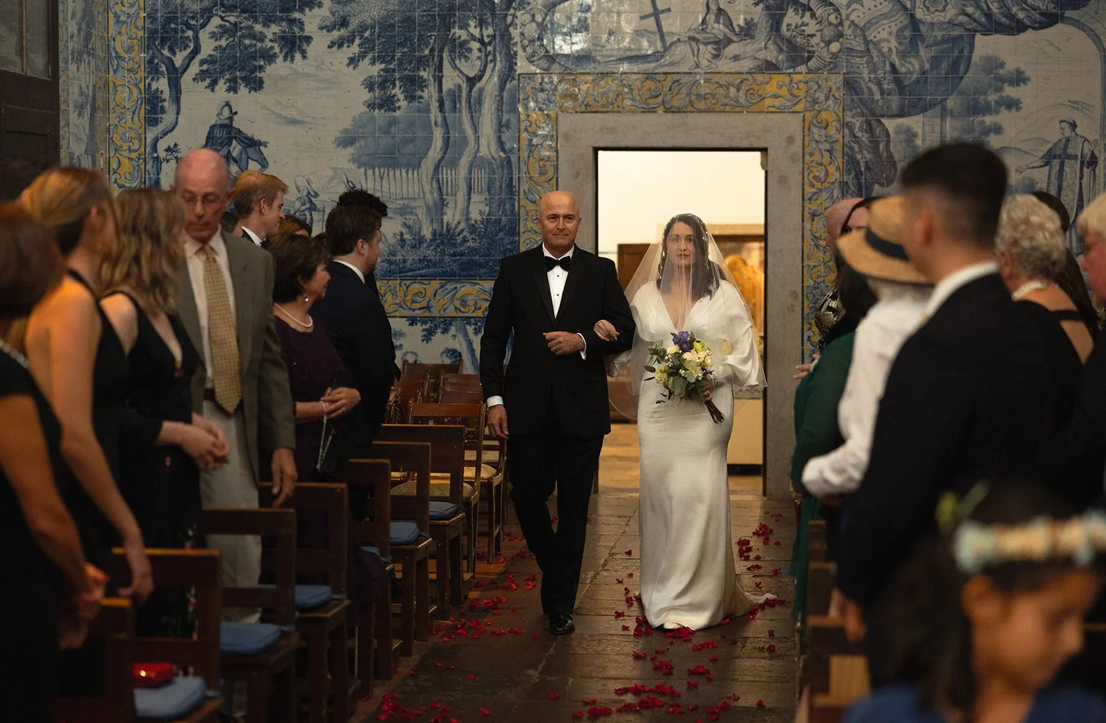 Bride and father in azulejo tile chapel aisle at Convento dos Cardães Lisbon Portugal | destination wedding photography by The Lopes Photography