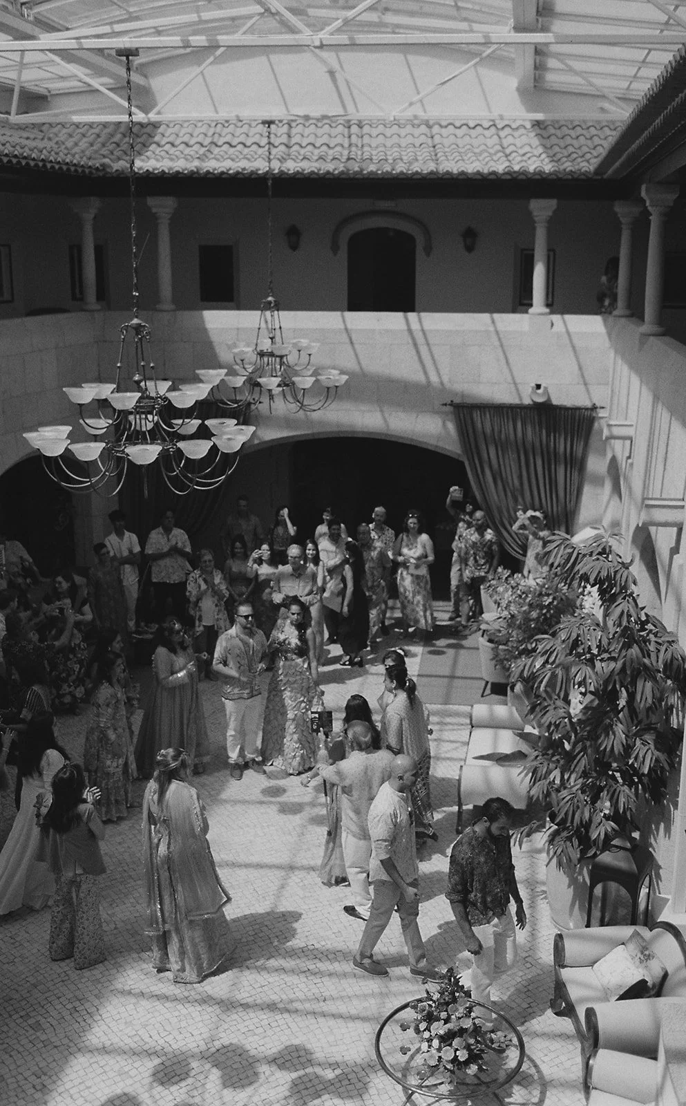 Mehndi ceremony under chandeliers in the stone courtyard at Fortaleza do Guincho | The Lopes Photography*