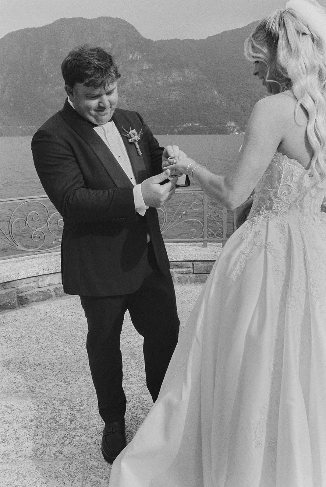 Groom placing the ring on bride's finger, Villa Balbiano, wedding photography by The Lopes Photography
