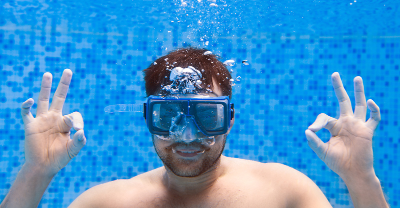 bigstock-Young-Man-In-Diving-Mask-Swimm-197598550 copy.jpg