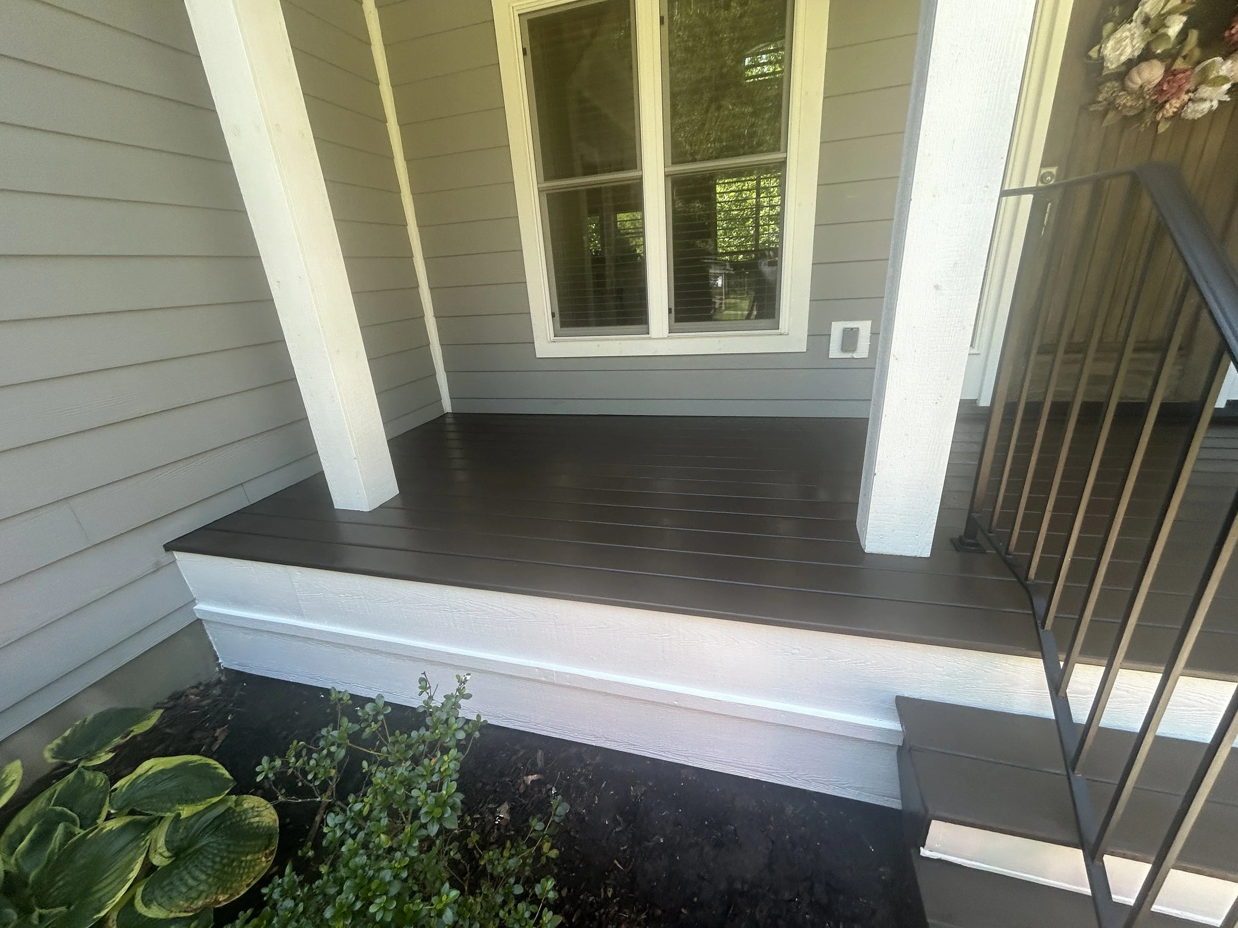 Freshly painted and clean porch completed by Zen Haven Handyman in Asheville, NC with sparkling finish