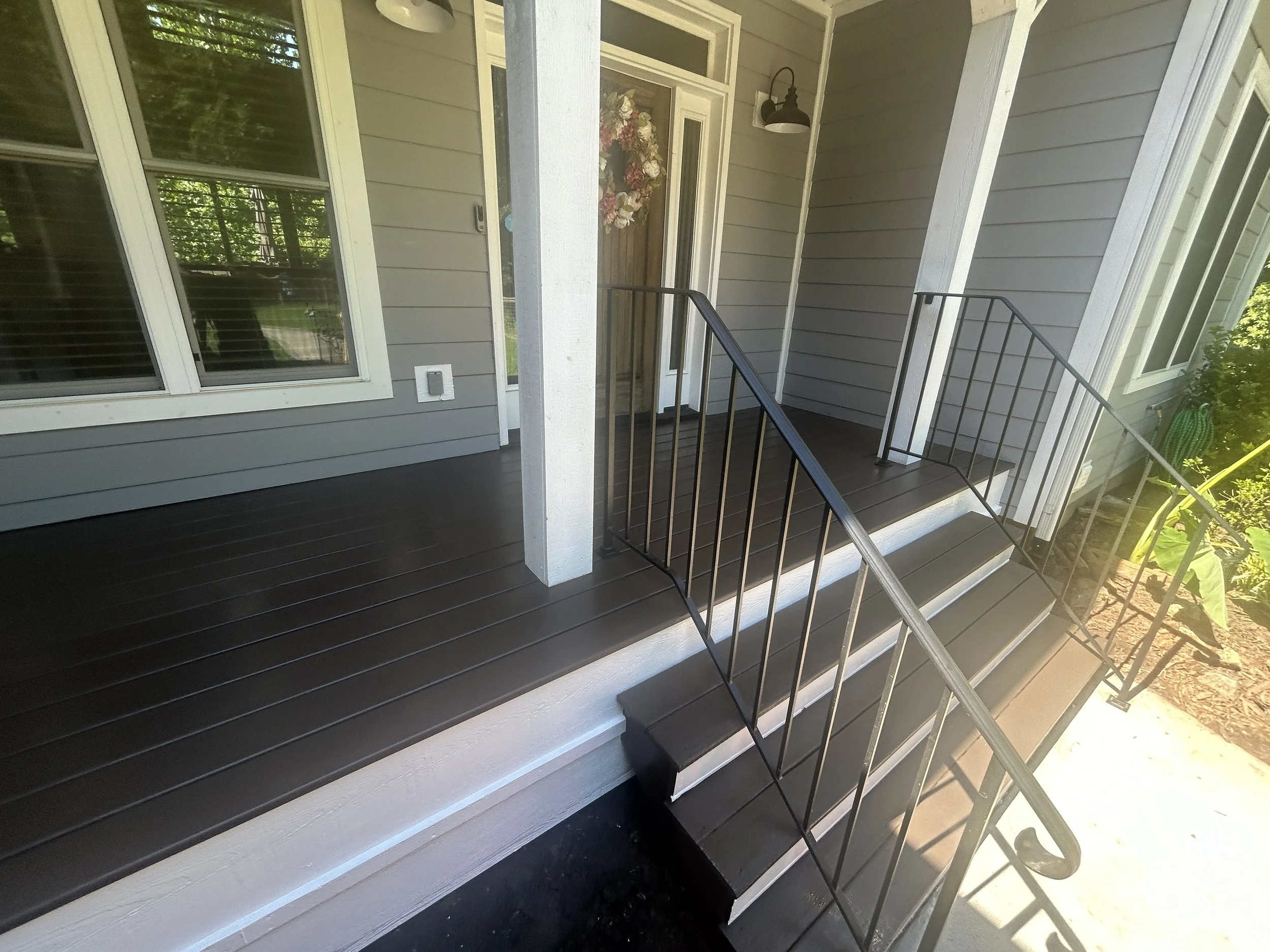 Freshly painted and clean porch completed by Zen Haven Handyman in Asheville, NC with sparkling finish