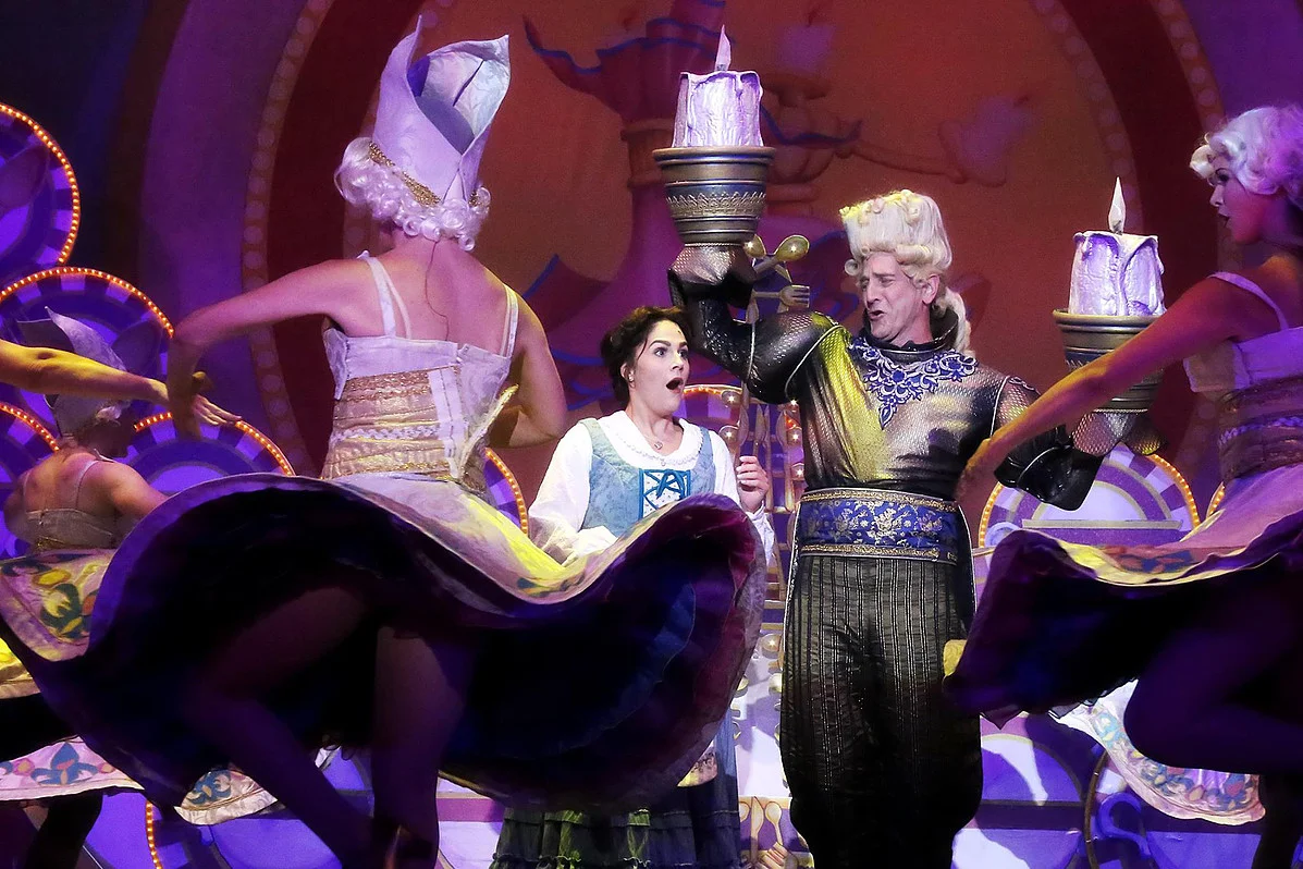  Pictured: Catherine Charlebois (Belle), Dirk Lumbard (Lumiere) and the cast of Disney's BEAUTY AND THE BEAST.  Photo by Curtis Brown Photography. 