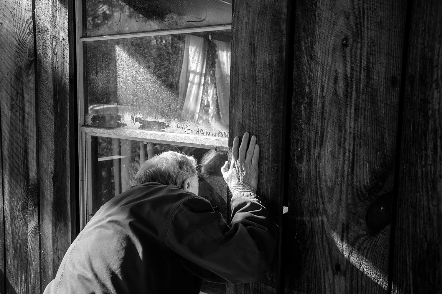 Jared Ragland . December 11, 2014. Billy Cooke, 81, looks into the home of his great-grandfather, James Thaddeus Cooke, in Hull, Walker County, Alabama.