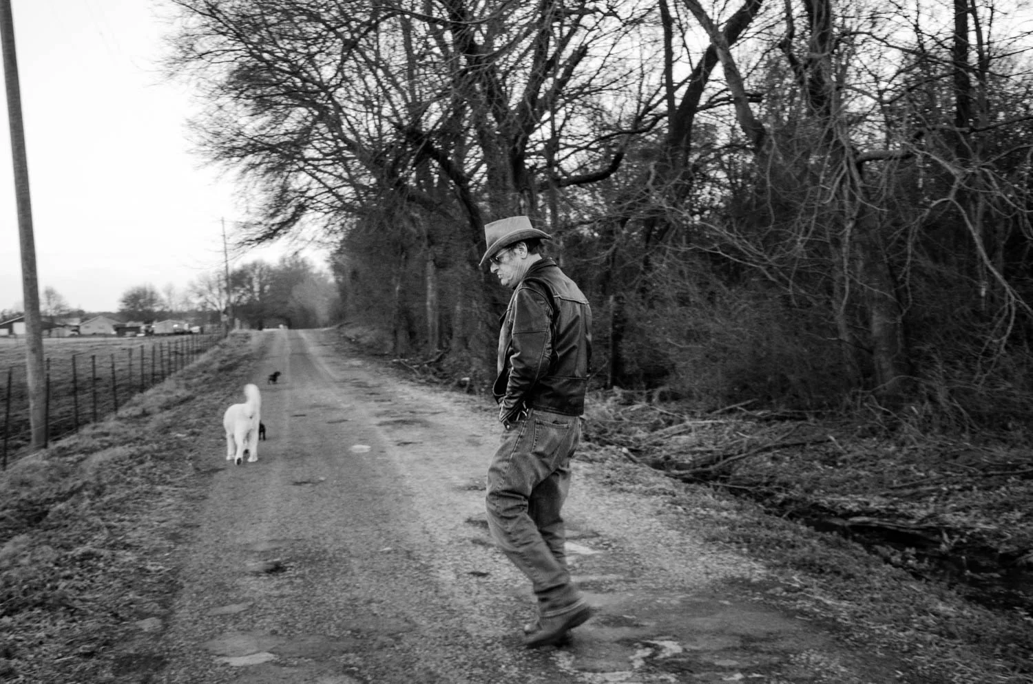 Christianna Traynor . March 6, 2015. Dad and his dogs. Albertville, Marshall County, Alabama.