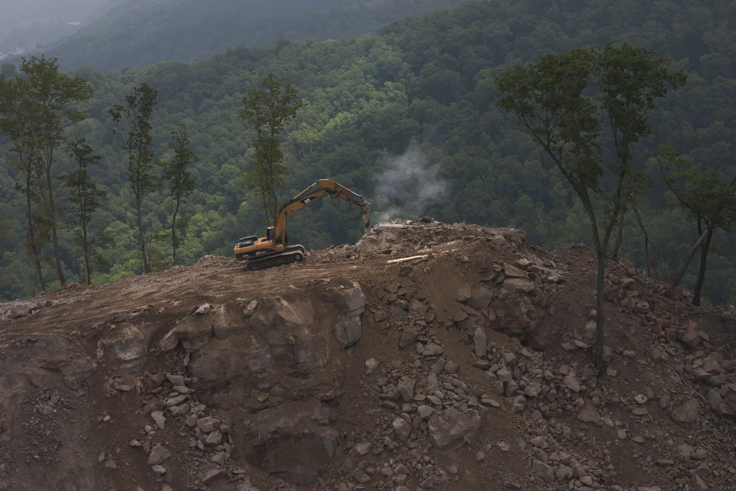 Dobree Adams . June 21, 2014. Lost forever. Destroying the last fringe of the forest; active mine site, Perry County, Kentucky.
