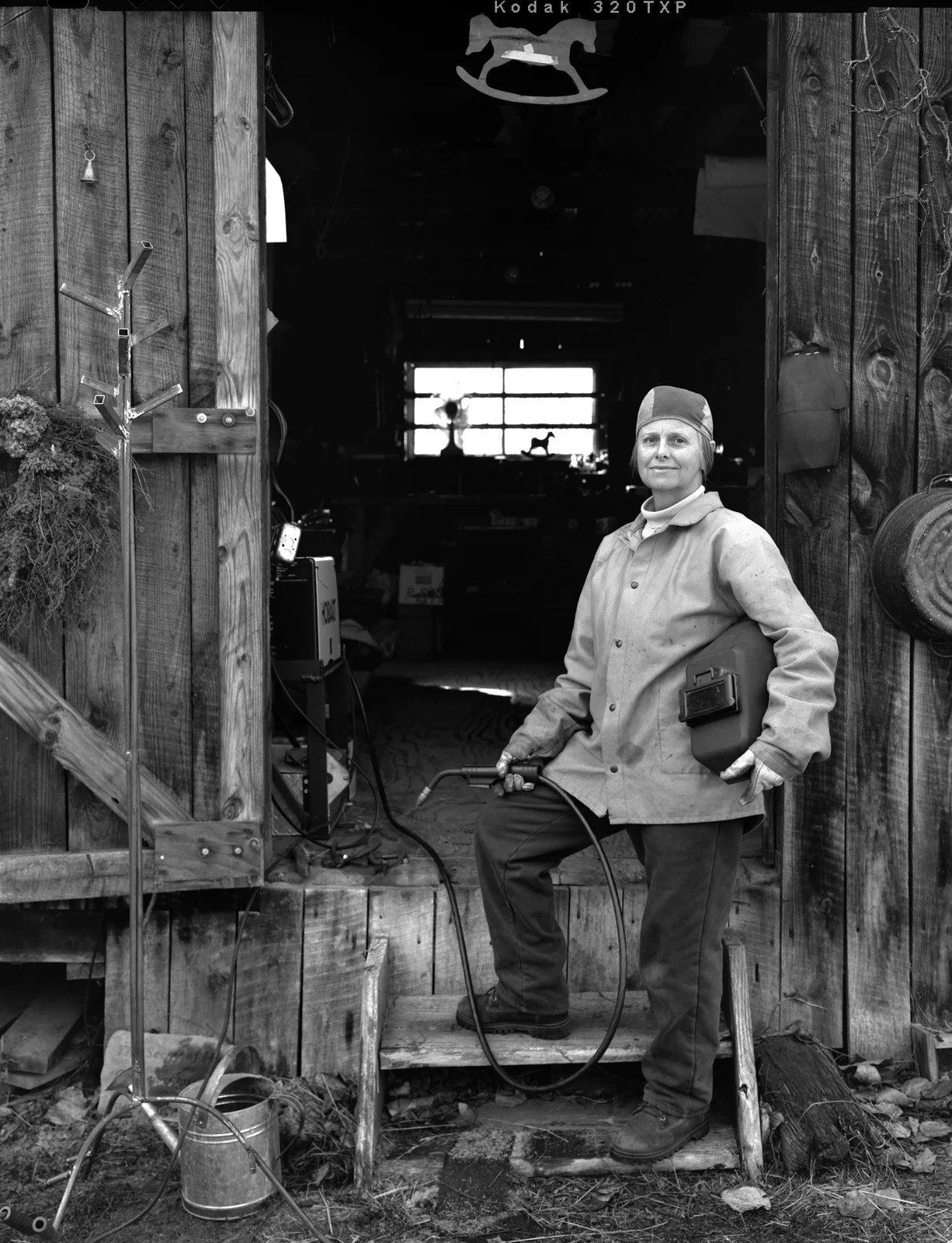 Dennis Savage . May 20, 2014. Melinda Armstrong welding a stand for a craft project, Hocking County, Ohio.
