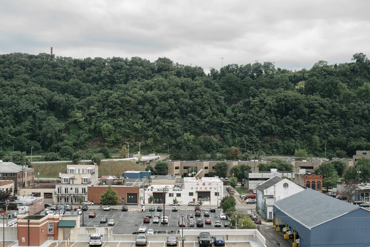 Kristian Thacker . September 9, 2016. Looking across the Strip from a 5th floor window at the Cork Factory. Pittsburgh, Allegheny County, Pennsylvania.