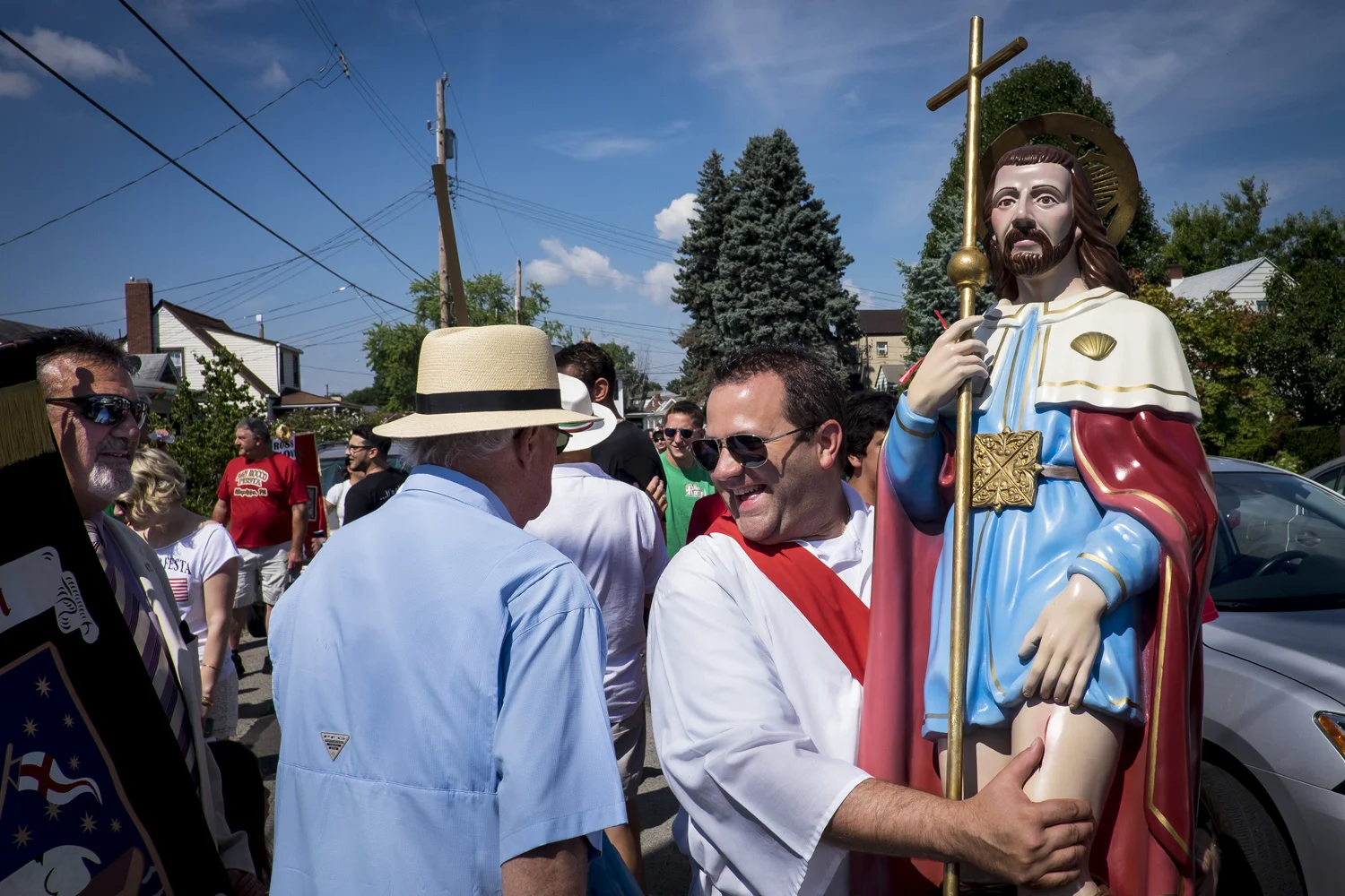 Pete Marovich . August 9, 2015. A parade member carries the statue of San Rocco, patron Saint of Patrica, Italy, to the beginning of the route for the start of the 90th annual San Rocco Festa procession. The festival, a three-day religious celebration, is held annually in August honoring St. Rocco, a patron saint of the city of Potenza, Italy where many Italians in Aliquippa can trace their ancestry. Aliquippa, Beaver County, Pennsylvania.