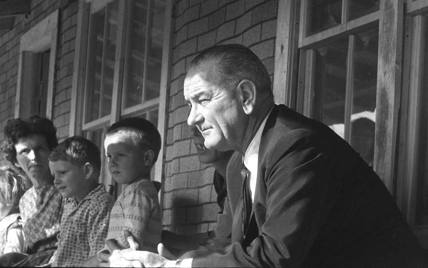 (President Lyndon B. Johnson visit to Tom Fletcher residence during Poverty Tour of Appalachia. Serial Number: 215-21-WH64. Date: 04/24/1964. Credit: LBJ Library photo by Cecil Stoughton.)
