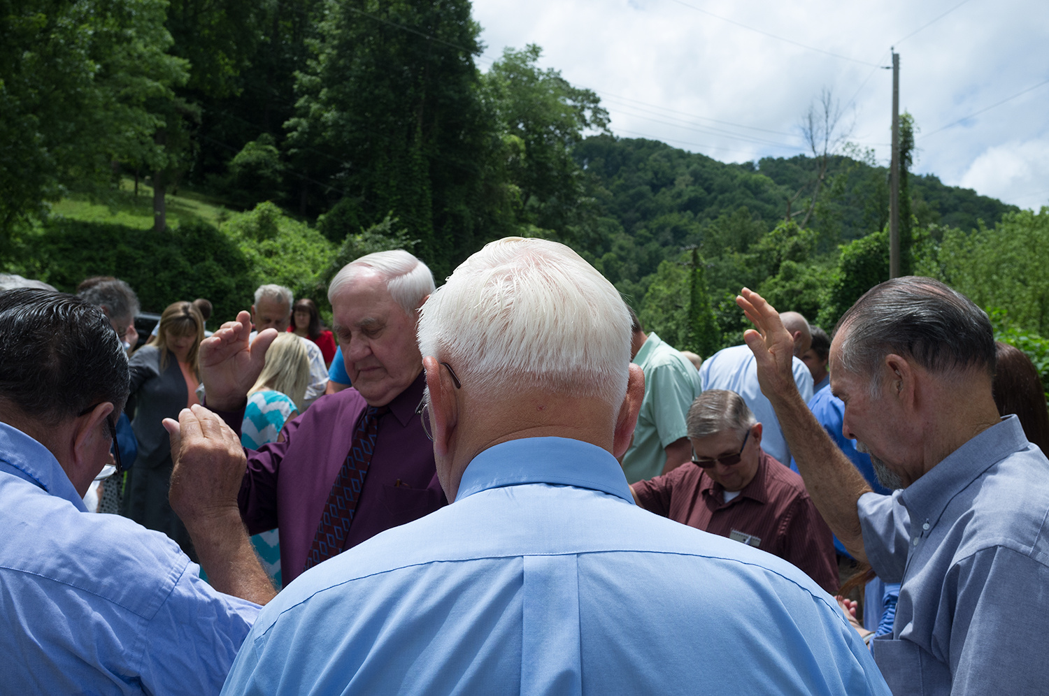 Roger May . July 5, 2015. Members of the Dix Fork Old Regular Baptist Church pray after baptizing Ruth Vanhoose, 84, of Chattaroy, West Virginia. She was baptized in Big Creek, Pike County, Kentucky, where members have been baptized for decades.