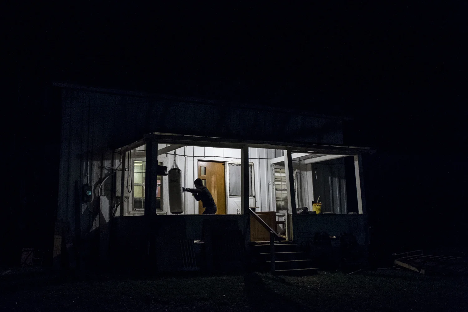 Sam Owens . January 3, 2016. Dakota Flowers spends an hour boxing on the front porch, eventually busting his hand open, at his house. Flowers, who works out nearly every day in-between his busy schedule of working for Coalfield Development Corporation and going to community college. Lincoln County, West Virginia.