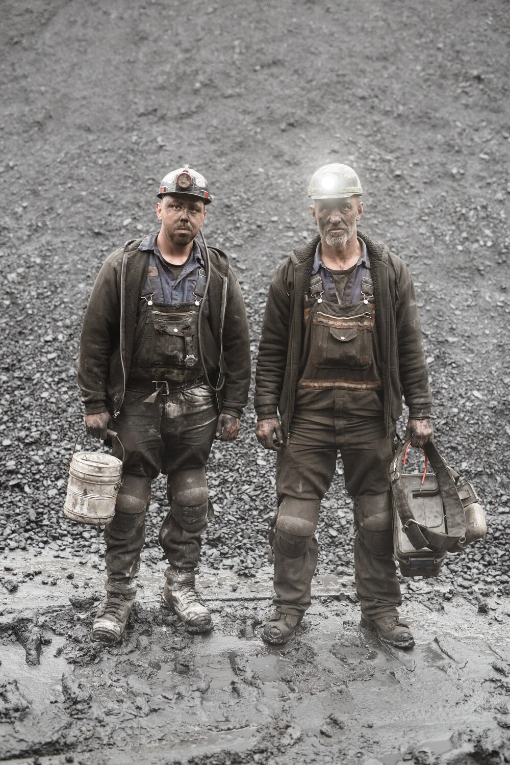   Miikka Pirinen . January 18, 2019. Mine electricians Jason Green and Cameron Rifle outside EDM mine No.1, Welch, McDowell County, West Virginia. 