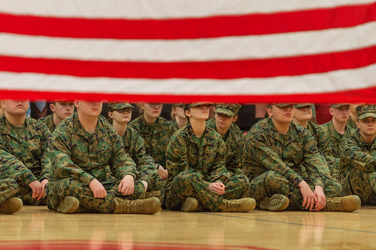   Craig Hudson . February 5, 2018. Specialist Colin Ramsey and Specialist Nicholas Letterman fold an American flag as ROTC cadets and students look on during a "Salute the Flag" ceremony at Sissonville High School in Sissonville, Kanawha County, West