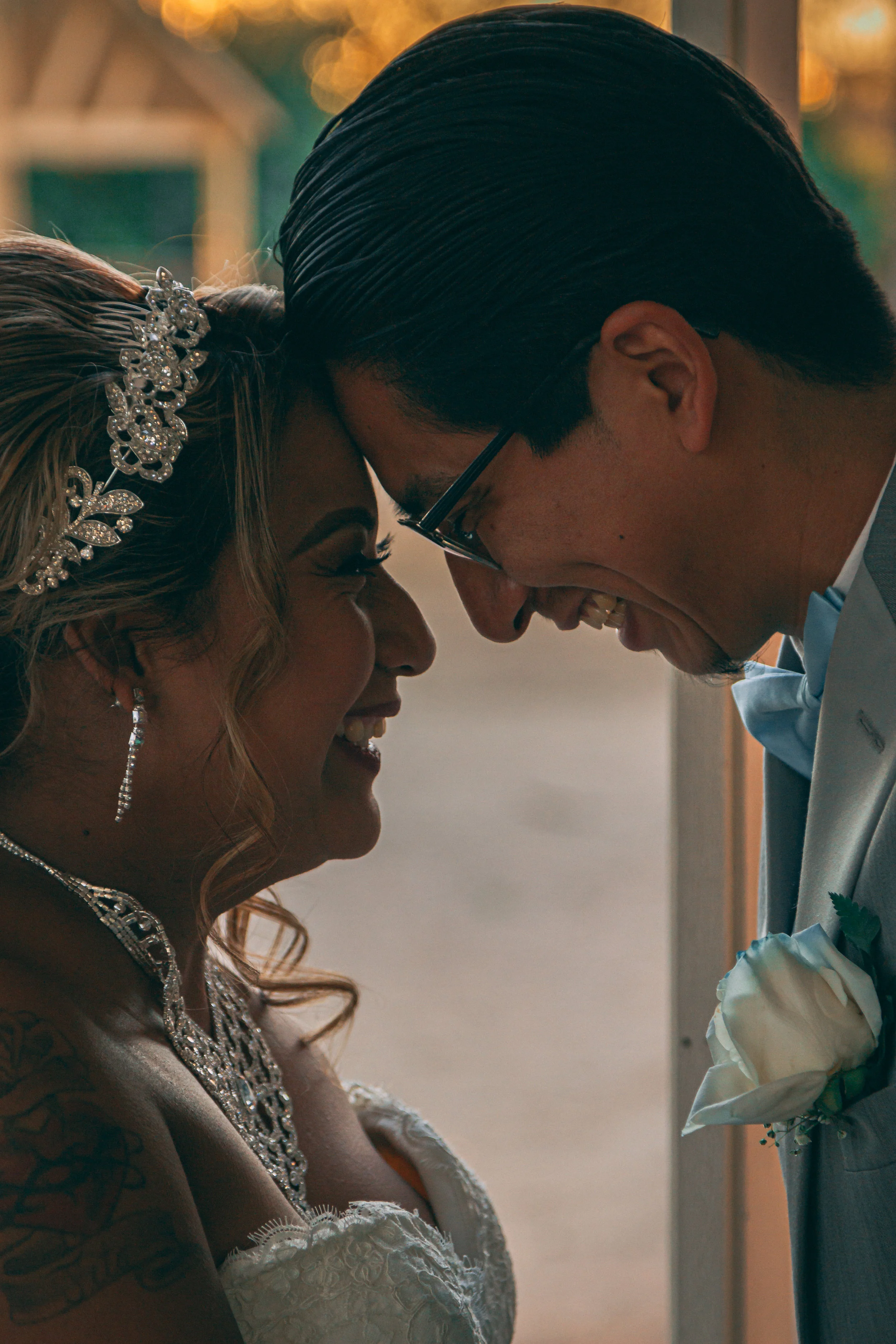 Intimate portrait of a bride and groom with foreheads together, wedding photography by Everlux Photo Co.