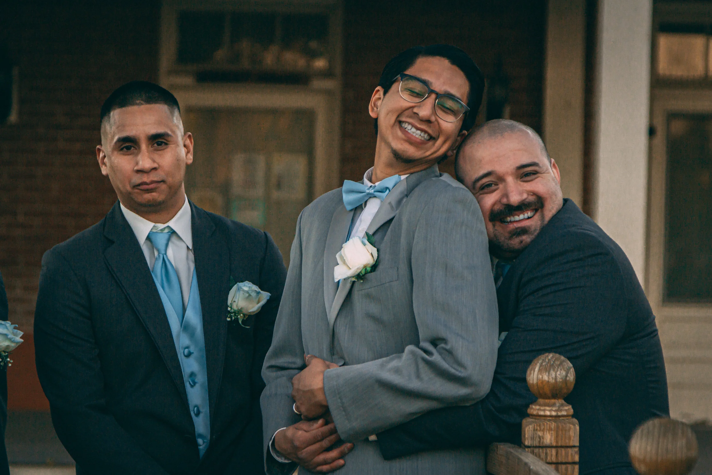 Portrait of two men in wedding attire sharing a moment, wPortrait of three men in wedding attire sharing a moment together, wedding photography by Everlux Photo Co.edding photography by Everlux Photo Co.