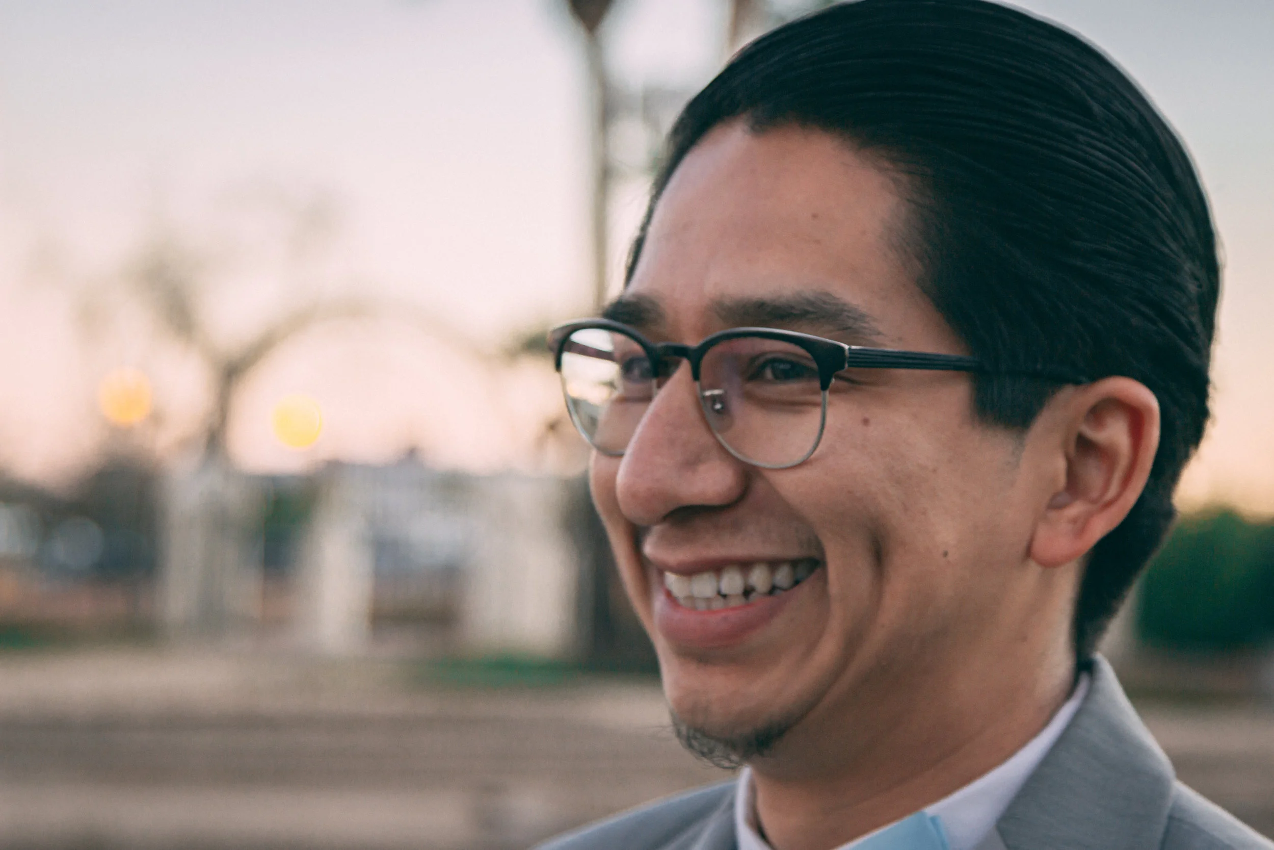 Portrait of a smiling man in glasses at an outdoor event, portrait photography by Everlux Photo Co.