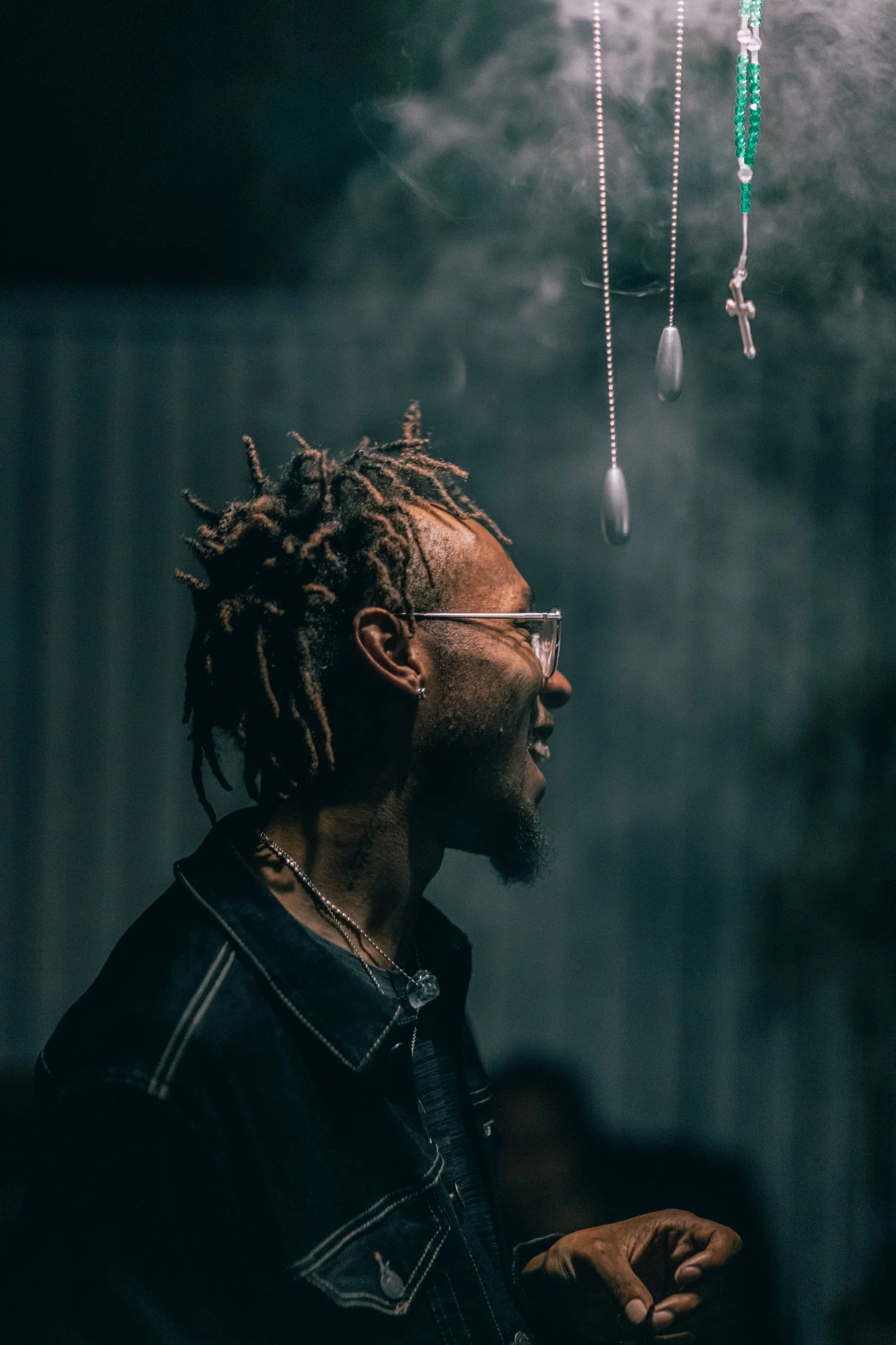 Side-profile portrait of a man with a hazy atmospheric backdrop, portrait photography by Everlux Photo Co.